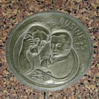 Business, one of the medallions on the floor of Old Holland, south end