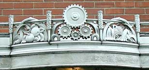 Symbols of agricultural engineering over south entrance, Dana Hall